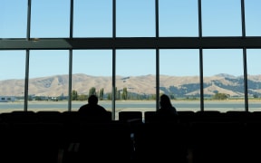 A married couple social distance at Marlborough Airport in March.