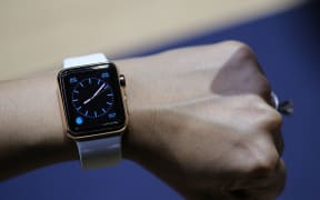 A journalist tests out one of new smartwatches.