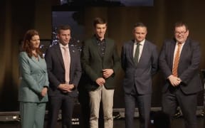 National's Nicola Willis, ACT's David Seymour, Jack Tame, Green's James Shaw and Labour's Grant Robertson pose for a photo following the ASB Great Debate in Queenstown on 14 September.