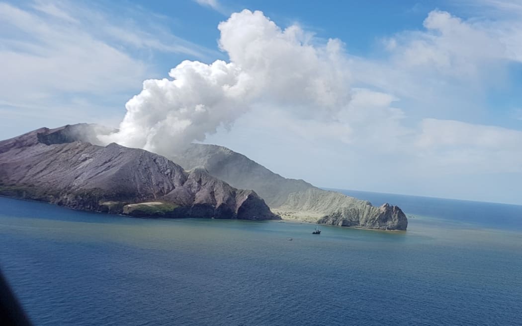 A view of Whakaari/White Island from the air as a helicopter approaches.