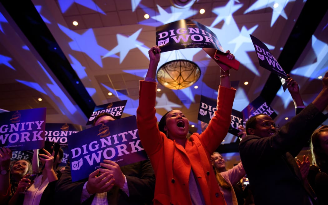 Supporters of Democrat senator Sherrod Brown celebrate his campaign victory in Columbus, Ohio.