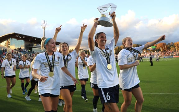 CARY, NORTH CAROLINA - OCTOBER 27: Abby Erceg #6 of North Carolina Courage celebrates with the trophy after defeating the Chicago Red Stars 4-0 to win the 2019 NWSL Championship at WakeMed Soccer Park on October 27, 2019 in Cary, North Carolina.   Streeter Lecka/Getty Images/AFP