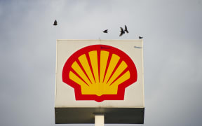 Birds fly over a British-Dutch oil and gas company Royal Dutch Shell PLC sign on October 7, 2020 in Warsaw, Poland.