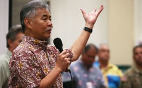 Hawaii Governor David Ige speaks at a community meeting in the aftermath of eruptions from the Kilauea volcano on Hawaii's Big Island