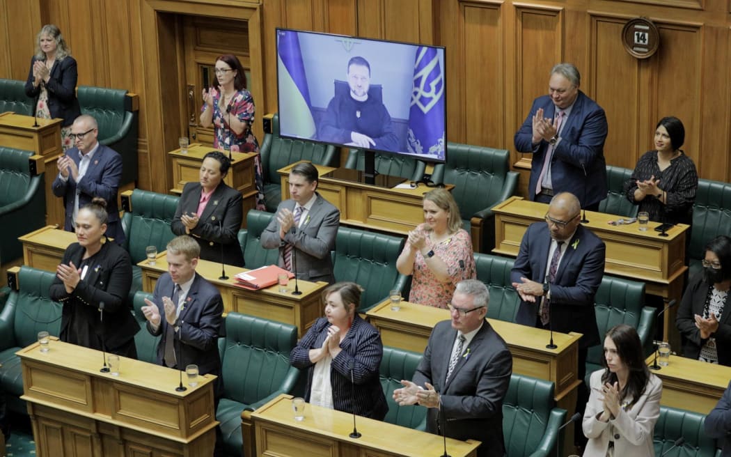 New Zealand MPs applaud Ukraine President Volodymyr Zelensky after his address to the Parliament.