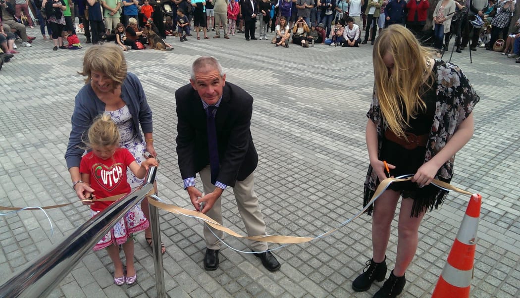 Andrew Turner (centre) was one of those who cut the ribbon to open the square.