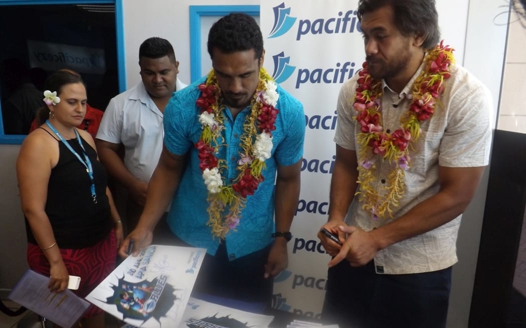 Blues loose forwards Jerome Kaino and Steven Luatua at a signing session in Samoa.