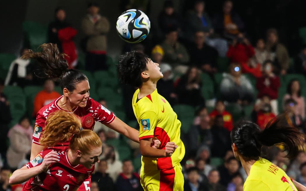 China's midfielder Wu Chengshu heads the ball during the Group D football match between Denmark and China at Perth Rectangular Stadium on 22 July, 2023.