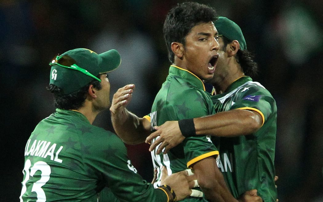 The banned Pakistan cricketer Raza Hasan celebrates taking a wicket with his Pakistan team-mates.