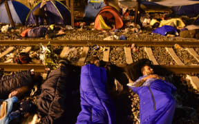 Syrian refugees sleep on the railway in Tovarnik, Croatia.