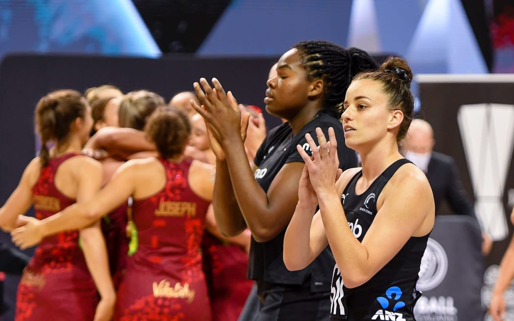 Knocked down Georgia Tong (r) and Grace Nweke of the Silver Ferns after losing the third Test against England, 2021.