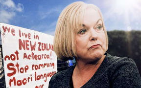 Judith Collins with sign 'We live in New Zealand not Aotearoa'