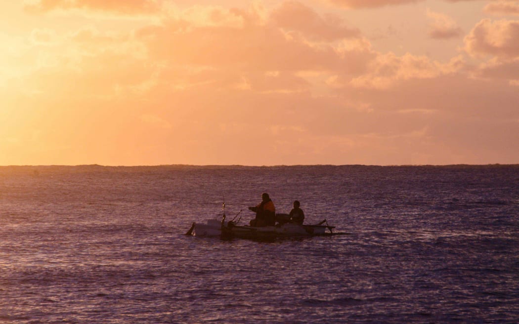 Fishing at sunset off Mangaia, Cook Islands