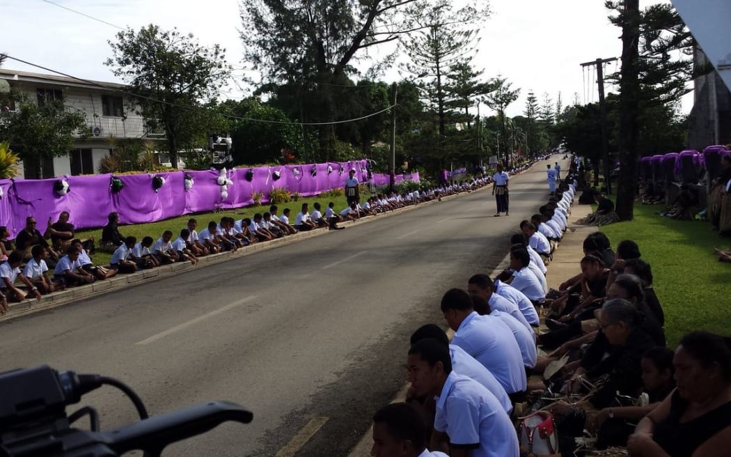 School children line the streets waiting for the Queen Mother's funeral procession
