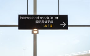 Signage for check-in at Auckland International Airport