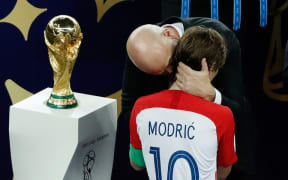 FIFA president Gianni Infantino speaks with Croatia's midfielder Luka Modric after the Russia 2018 World Cup final football match between France and Croatia in Moscow.