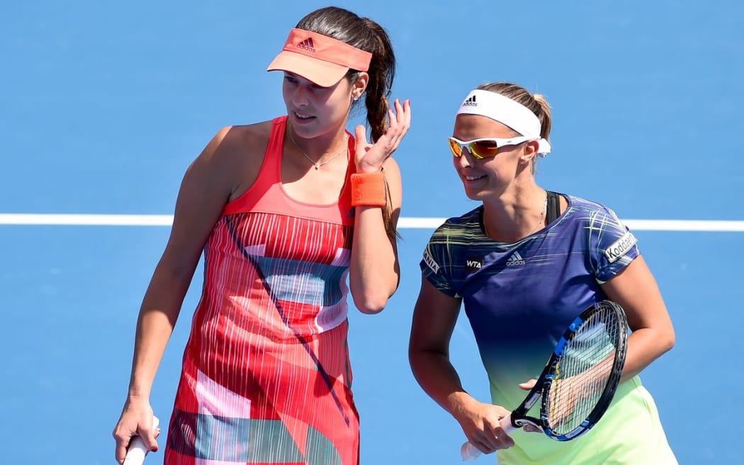 Ana Ivanovic (L) and Kirsten Flipkens  confer during an ASB Classic doubles match, Monday 4 January 2016. Copyright Photo: Chris Symes / www.photosport.nz