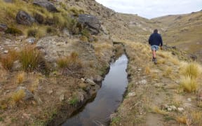 Water channel dug into Otago hillside