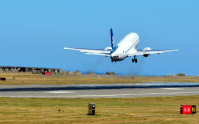 An Air NZ plane takes off from Wellington Airport.
