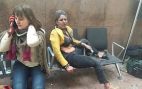 An injured woman at Zaventem airport following the explosions.