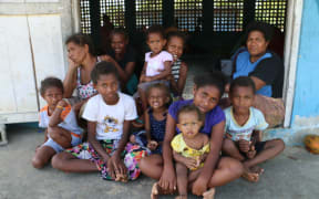 Wendy Karo( far right back row) says mothers in the evacuation centres worry for their children's education.