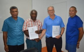 Van2017 CEO Clint Flood (2R) with representatives of Vanuatu's Seventh Day Adventist Mission.