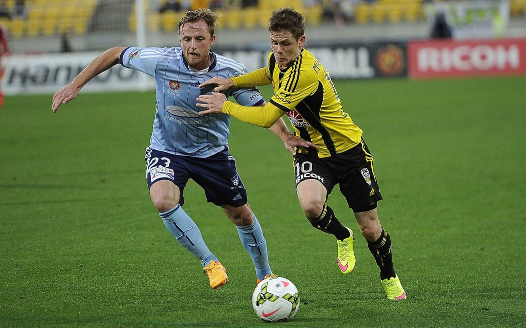Wellington Phoenix midfielder Michael McGlinchey (right) battles for possession with Sydney FC defender Rhyan Grant.