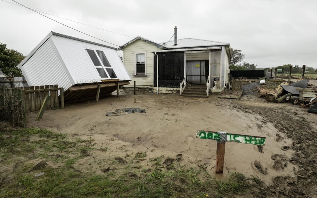 A shed is knocked off its foundation on a flood-damaged property in wairoa.
