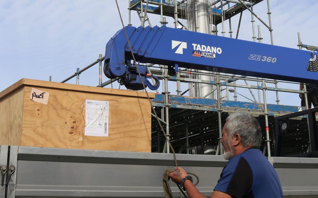 Sculptor Tom Hei Hei returns his cast manu (birds) to the top of Te Haa o Te Ao after damage by vandals in April 2022.