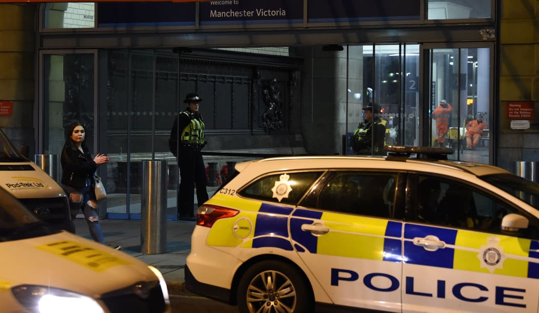 Police officers stand near a cordon at Manchester Victoria Station, in Manchester  following a stabbing. January 1 2019