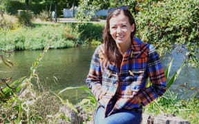 Ecan Councillor and fresh water ecologist, Lan Pham, by the river Avon