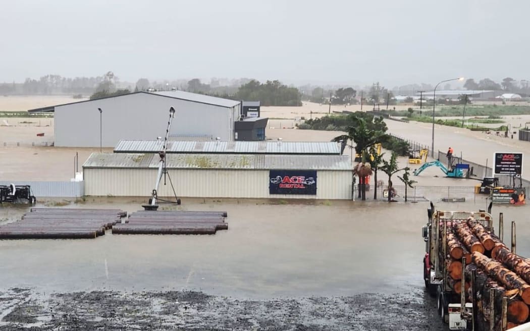 ACE Rentals in Dargaville have been delivering excavators and sweepers through the night to help clear storm damage, but the company's yard flooded with the heavy rain