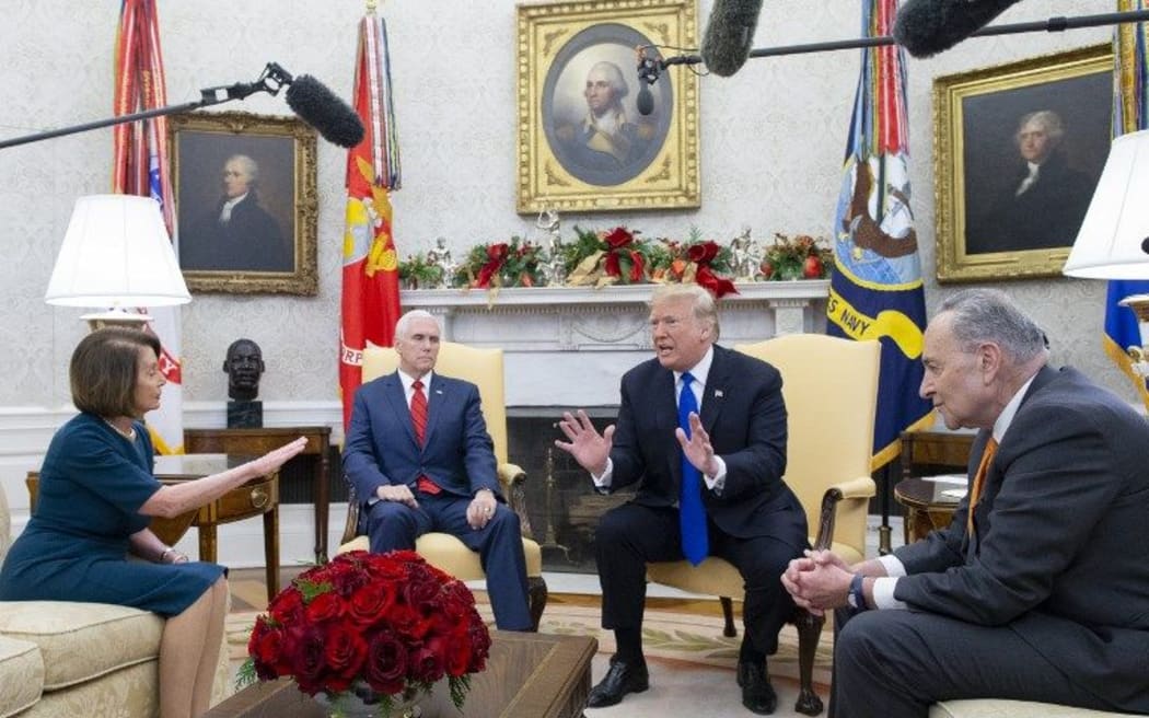 Donald Trump (C) US House Speaker-designate Nancy Pelosi (L) and US Senate Minority Leader Chuck Schumer (R) argue as US Vice President Mike Pence (2-L) looks on. White House, 11 December 2018.