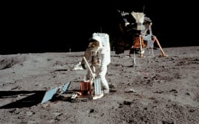 Buzz Aldrin conducts experiments on the moon's surface in a picture taken by Neil Armstrong after both climbed down the ladder of the lunar module "Eagle" on July 21, 1969 to become the first men in history to set foot on the moon's surface.