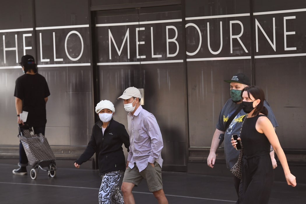 People return to Melbourne's central business district on 9 November 2020 as Australia's Victoria state government announces an easing of restrictions with no new cases of Covid-19 recorded for the tenth day in a row.