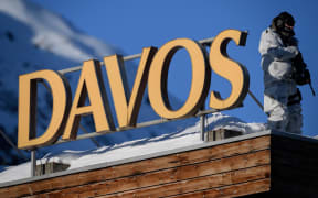 In this file photo taken on January 20, 2020, a policeman  stands on the rooftop of a hotel during the World Economic Forum (WEF) annual meeting in Davos.