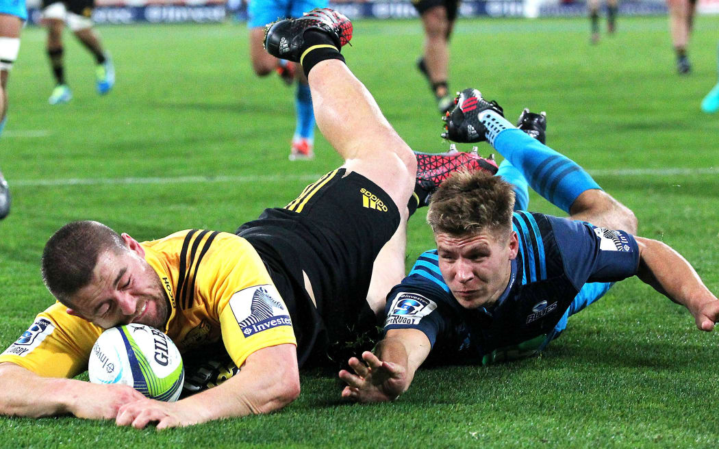 Dane Coles scores with the face.