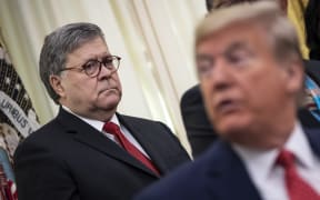 US Attorney General William Barr and US President Donald Trump in the Oval Office of the White House on 26 November 2019 in Washington, DC.