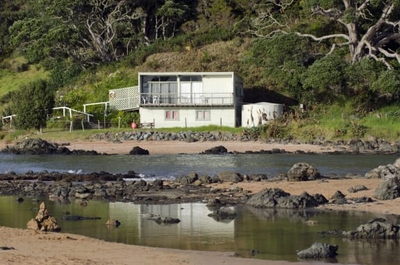 Remote bach holiday house on January 25 2013 in Cable bay, New Zealand. More than 50,000 baches exist around New Zealand
