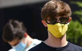 BOULDER, CO - AUGUST 18: Students wear masks while waiting in line for registration and an identifying wristband after receiving a negative test result for coronavirus upon arriving on campus at University of Colorado Boulder on August 18, 2020 in Boulder, Colorado.