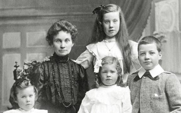 Marshall Walker's grandmother Isa with her children. Marshall's mother Nora is front centre and the boy is uncle Marshall.