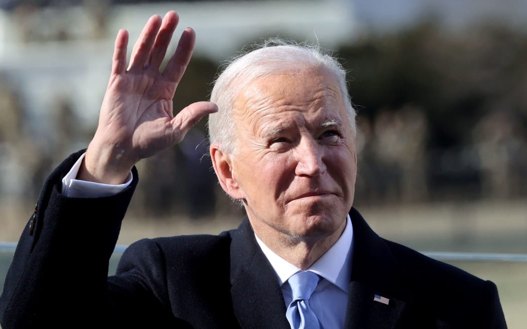 Joe Biden waves after being sworn in as the 46th US President  during his inauguration on January 20, 2021, at the US Capitol in Washington, DC. (Photo by JONATHAN ERNST / POOL / AFP)