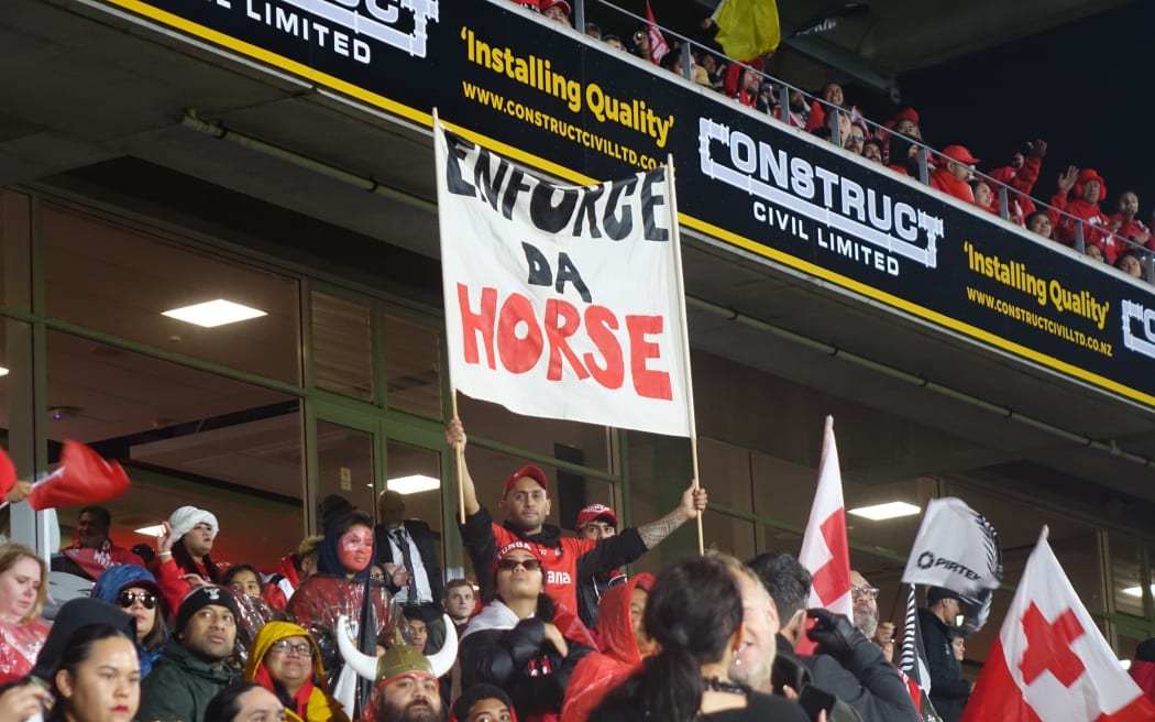 Despite some rain, Tonga fans kept up the cheer during halftime.