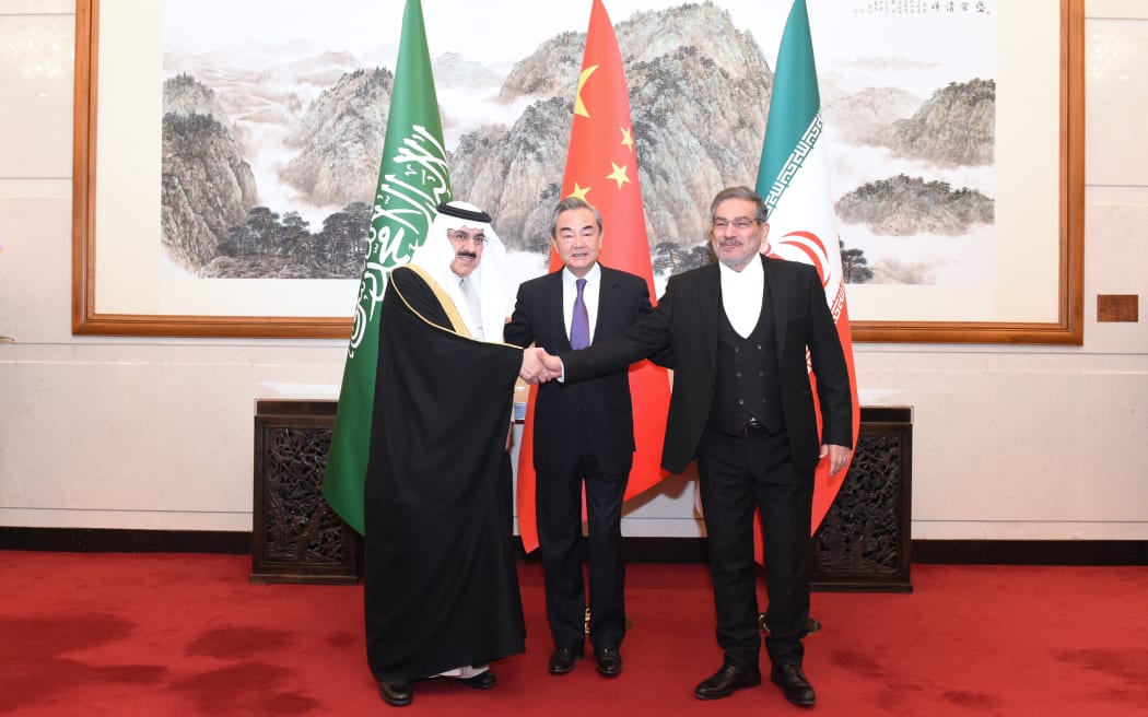 Wang Yi (centre), a member of the Political Bureau of the Communist Party of China (CPC) Central Committee and director of the Office of the Foreign Affairs Commission of the CPC Central Committee, attends a closing meeting of the talks between the Saudi delegation led byMusaed bin Mohammed Al-Aiban (left), Saudi Arabia's Minister of State, Member of the Council of Ministers and National Security Advisor, and Iranian delegation led by Admiral Ali Shamkhani (right), Secretary of the Supreme National Security Council of Iran, in Beijing, China, 10 March, 2023.
