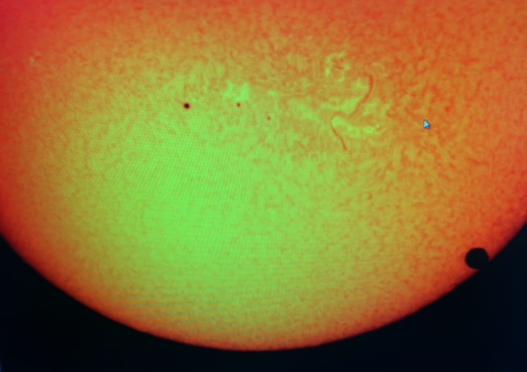 Venus begins its journey across the sun (far right) in this image captured via a telescope at the Auckland Stardome Observatory.