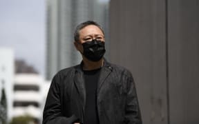Pro-democracy activist Benny Tai arrives at Ma On Shan police station in Hong Kong, on Sunday 28 February 2021.