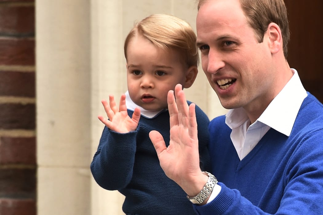 Prince William left the hospital to pick up 21-month-old Prince George, who offered the crowds a wave with his father.