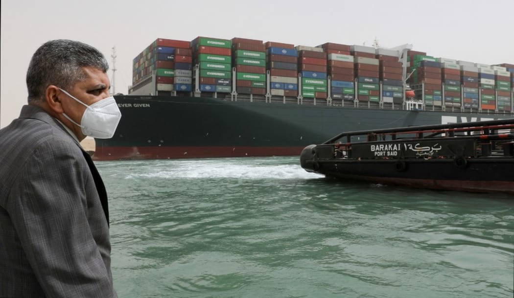 In this handout photo released by Suez Canal Press Service, Admiral Osama Rabie, Chairman and Managing Director of the Suez Canal Authority, watches the operation of unblocking the Ever Given container ship that ran aground in the Suez Canal,