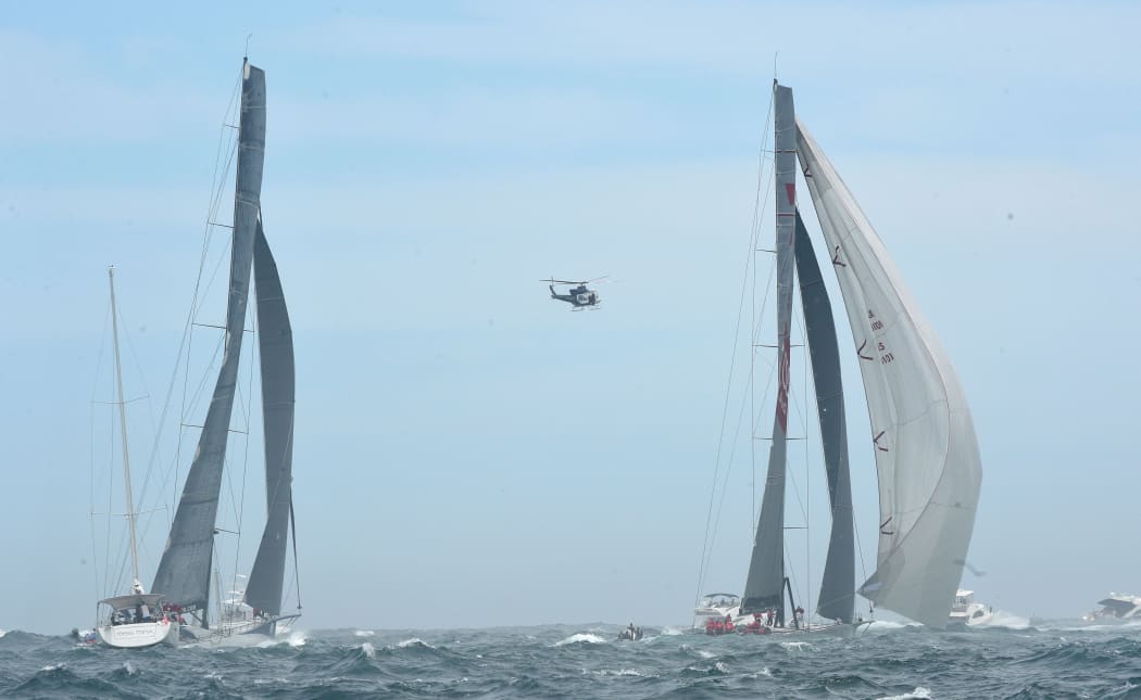 Yachts Wild Oats XI (R) and Ragamuffin 100 at the start of the 71st Rolex Sydney to Hobart yacht race on Sydney Harbour in Sydney on Saturday, Dec. 26, 2015.