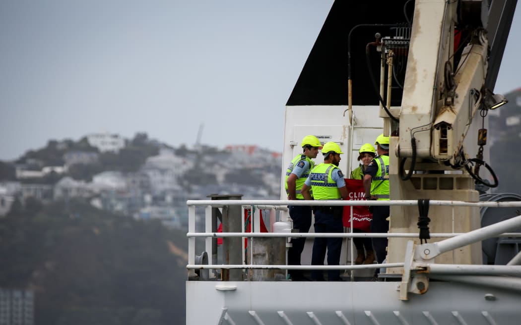Police on board the Tangaroa, the research ship boarded by Geenpeace activists in a protest over oil exploration.